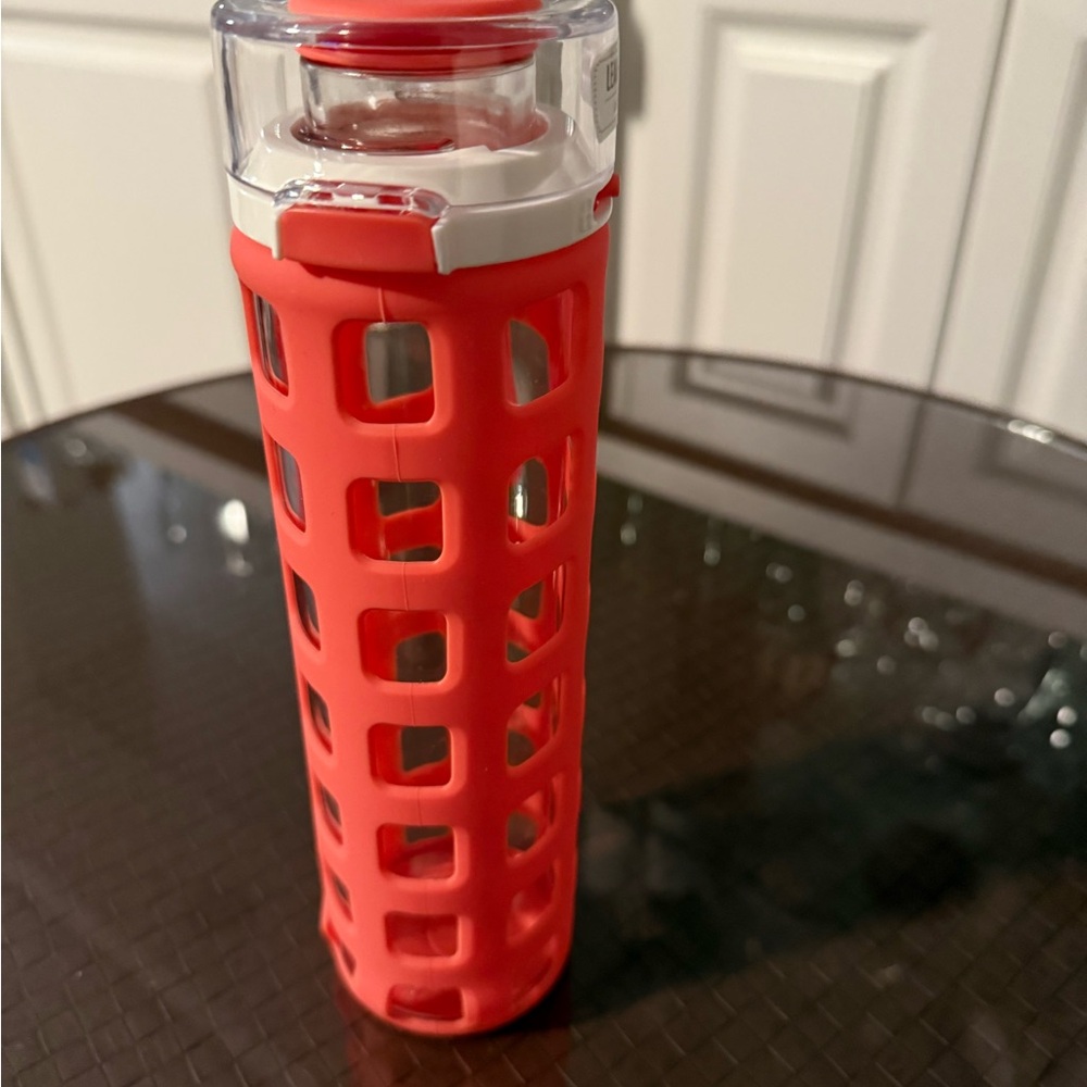 Coral Water Bottle with white Silicone Grip